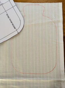 Draw around the pattern on the organic cotton fabric